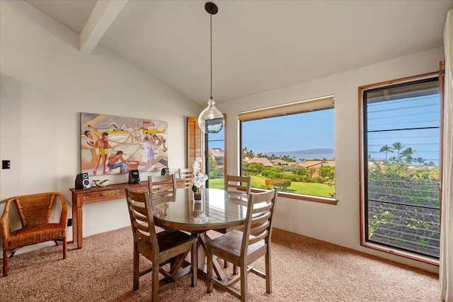 dining area featuring lofted ceiling with beams and light carpet