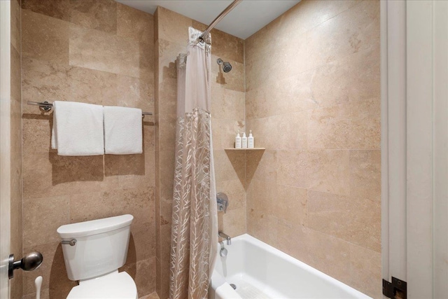 bathroom with shower / bath combo and toilet