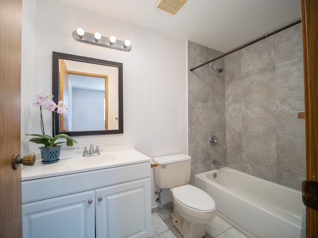 full bathroom with toilet, tiled shower / bath, tile patterned floors, and vanity