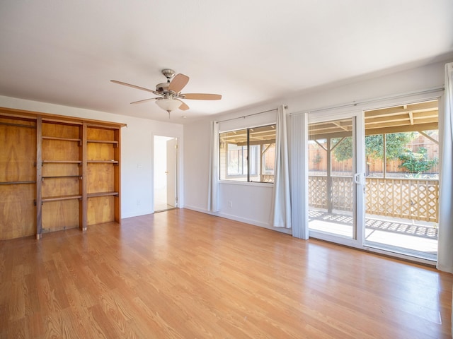 empty room featuring ceiling fan and light hardwood / wood-style flooring