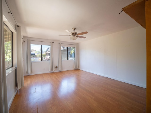 unfurnished room featuring ceiling fan and hardwood / wood-style flooring