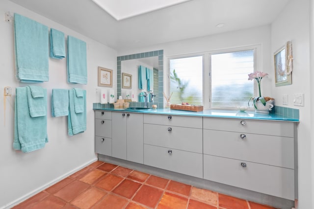 bathroom featuring tile floors and vanity