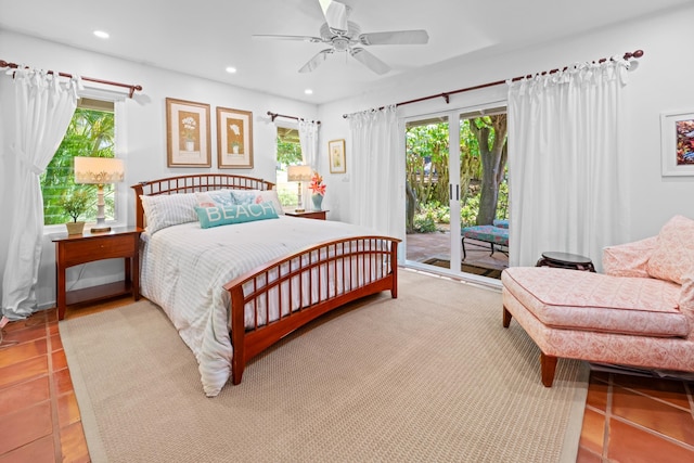 bedroom with light tile flooring, access to outside, ceiling fan, and multiple windows