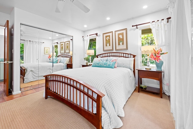 bedroom featuring ceiling fan and a closet