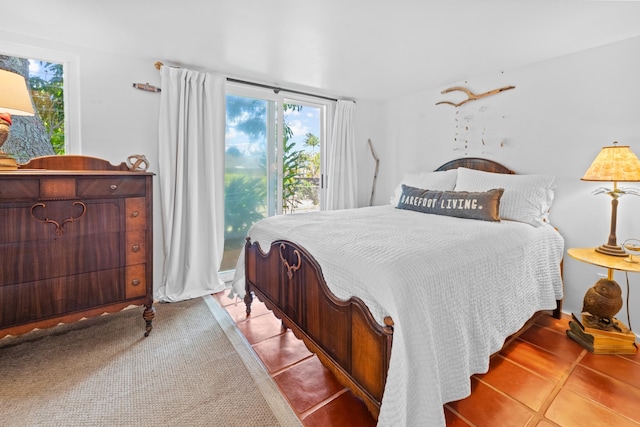 bedroom featuring light tile floors