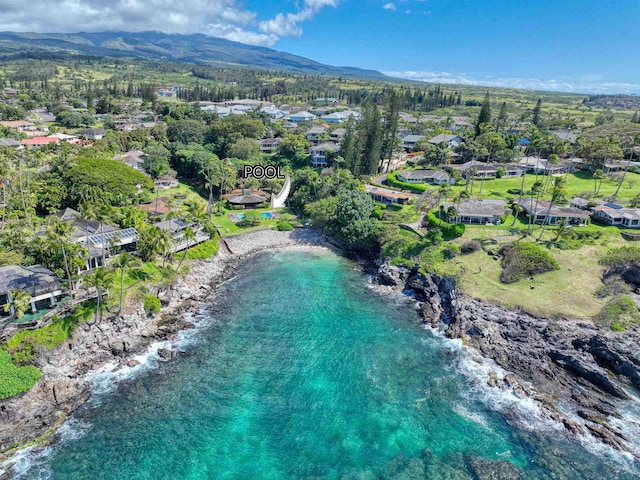 birds eye view of property featuring a water and mountain view