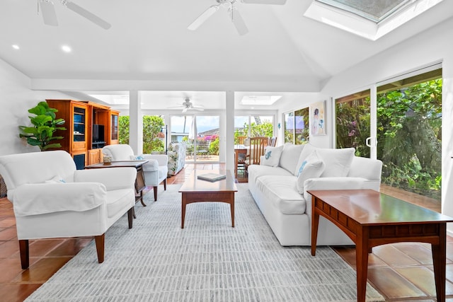 interior space featuring vaulted ceiling with skylight and ceiling fan