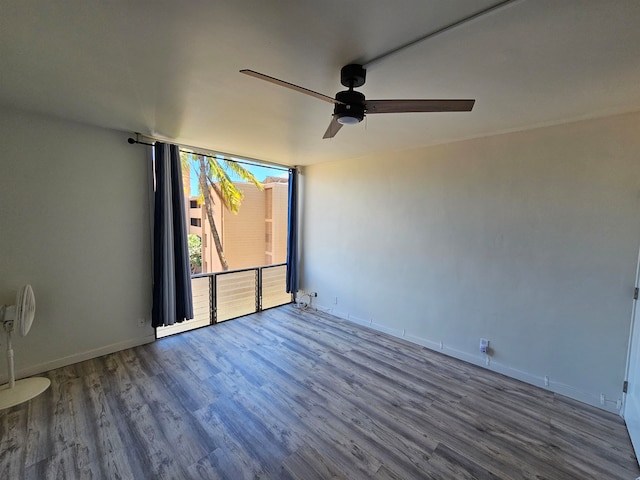 unfurnished room with wood-type flooring and ceiling fan