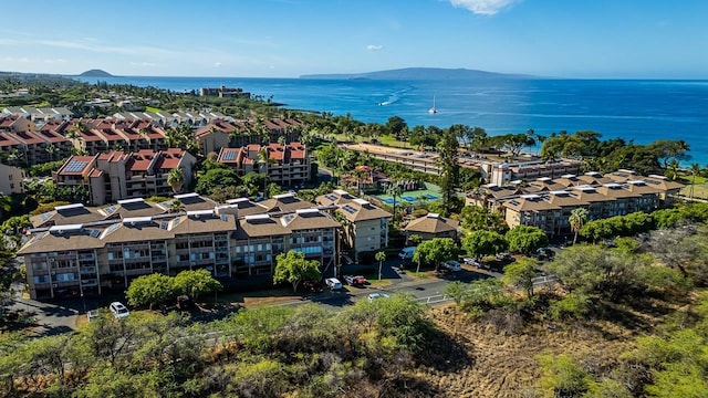 birds eye view of property featuring a water and mountain view