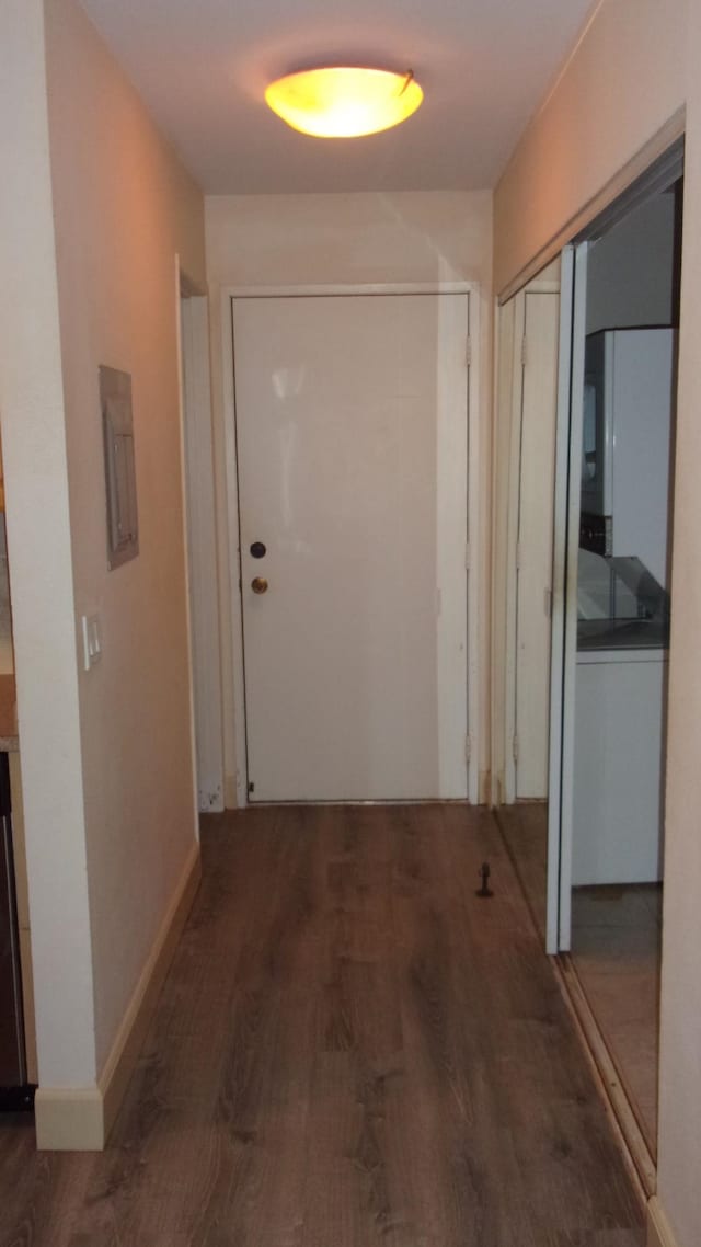 hallway with electric panel and dark hardwood / wood-style floors