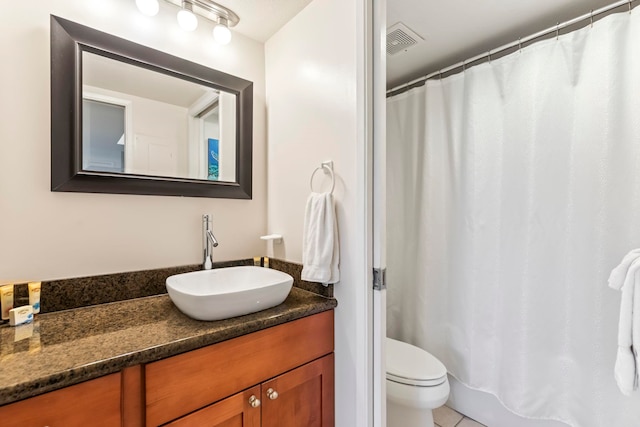 full bathroom featuring toilet, tile patterned floors, vanity, and visible vents