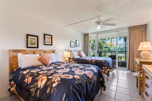 bedroom featuring a ceiling fan, a textured ceiling, light tile patterned flooring, and access to exterior