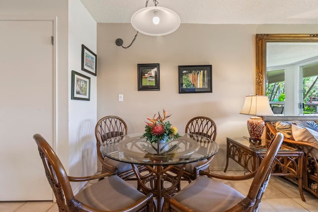 dining area with light tile patterned flooring