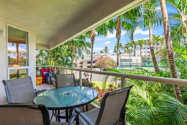 balcony featuring outdoor dining space