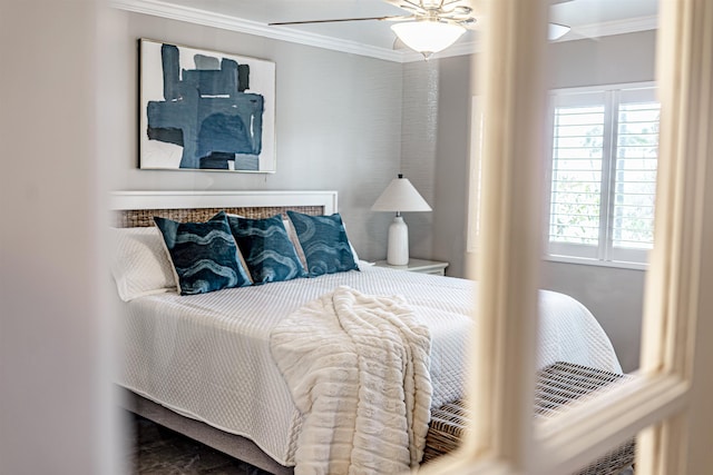 bedroom featuring a ceiling fan and crown molding