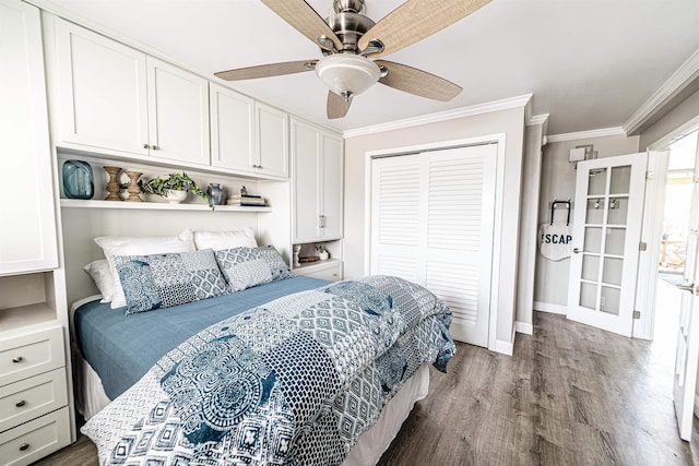 bedroom featuring ornamental molding, baseboards, ceiling fan, a closet, and wood finished floors