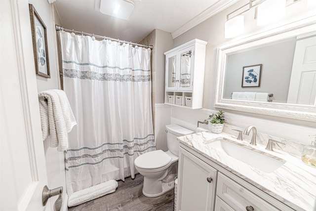 full bath with a shower with shower curtain, crown molding, toilet, wood finished floors, and vanity