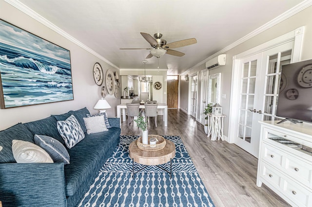 living room featuring a wall mounted AC, ornamental molding, french doors, and ceiling fan