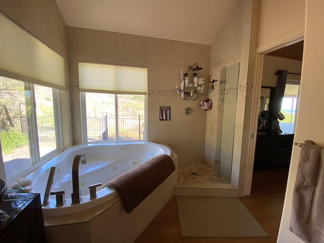 bathroom featuring plus walk in shower