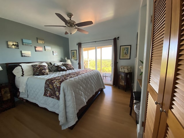 bedroom featuring wood-type flooring, access to outside, and ceiling fan