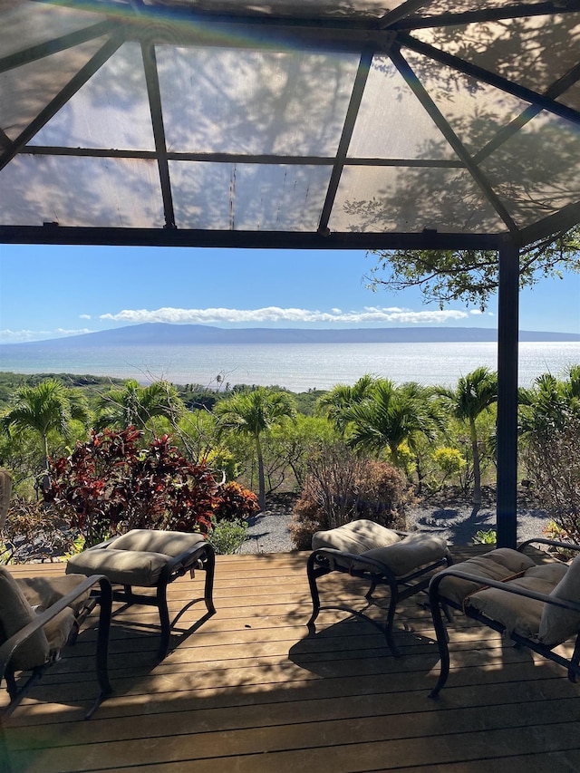 deck with a water and mountain view