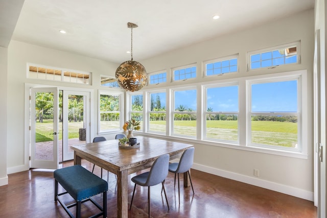 dining area featuring plenty of natural light, recessed lighting, french doors, and baseboards