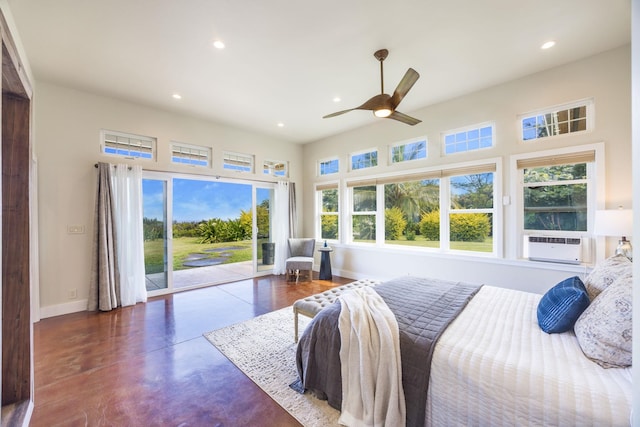 bedroom featuring access to outside, recessed lighting, finished concrete flooring, and baseboards