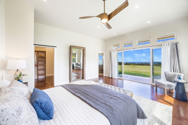 bedroom featuring recessed lighting, multiple windows, a ceiling fan, and access to outside