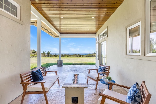 view of patio / terrace featuring an outdoor living space with a fire pit