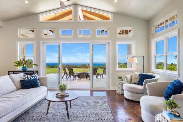 living area featuring recessed lighting, wood finished floors, baseboards, and high vaulted ceiling