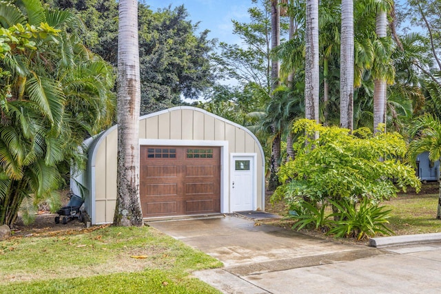 detached garage featuring driveway