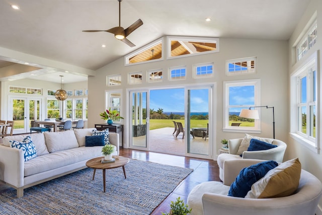 living area with recessed lighting, french doors, high vaulted ceiling, and wood finished floors