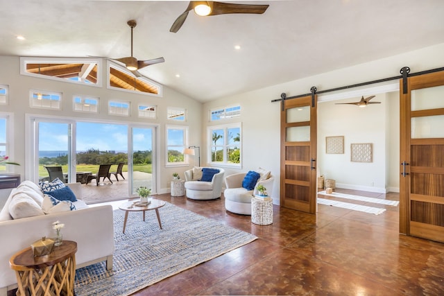 living room with a barn door, a healthy amount of sunlight, a ceiling fan, and high vaulted ceiling