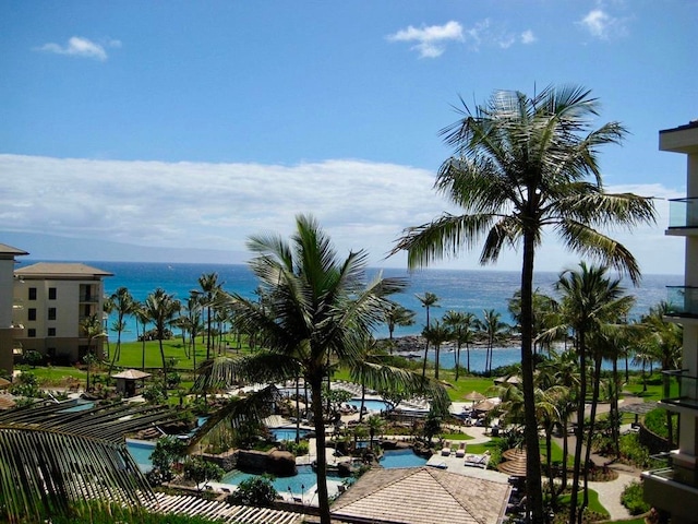 view of home's community with a water view and a swimming pool