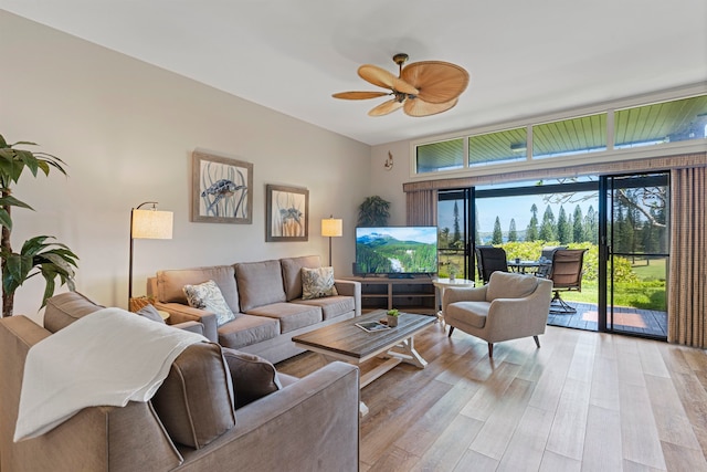 living room with light wood-type flooring and ceiling fan