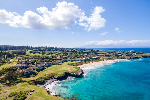 aerial view featuring a water view and a beach view