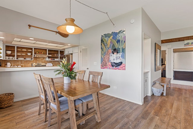 dining space with hardwood / wood-style flooring