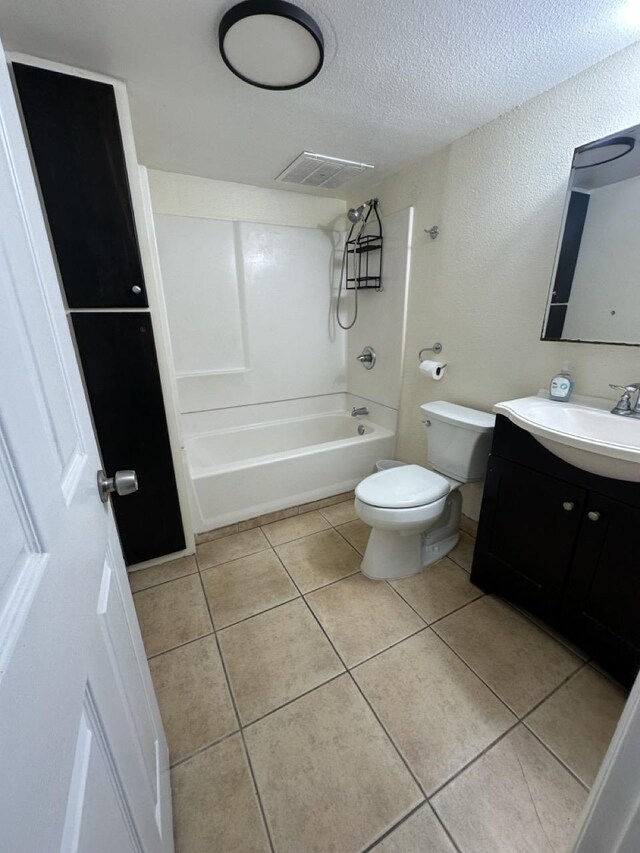 111 Kahului Beach Rd Unit A407, Kahului, HI 96732 - full bath with washtub / shower combination, tile patterned floors, a textured ceiling, toilet, and visible vents
