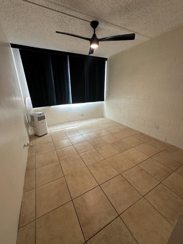 111 Kahului Beach Rd Unit A407, Kahului, HI 96732 - unfurnished room with tile patterned floors and concrete block wall