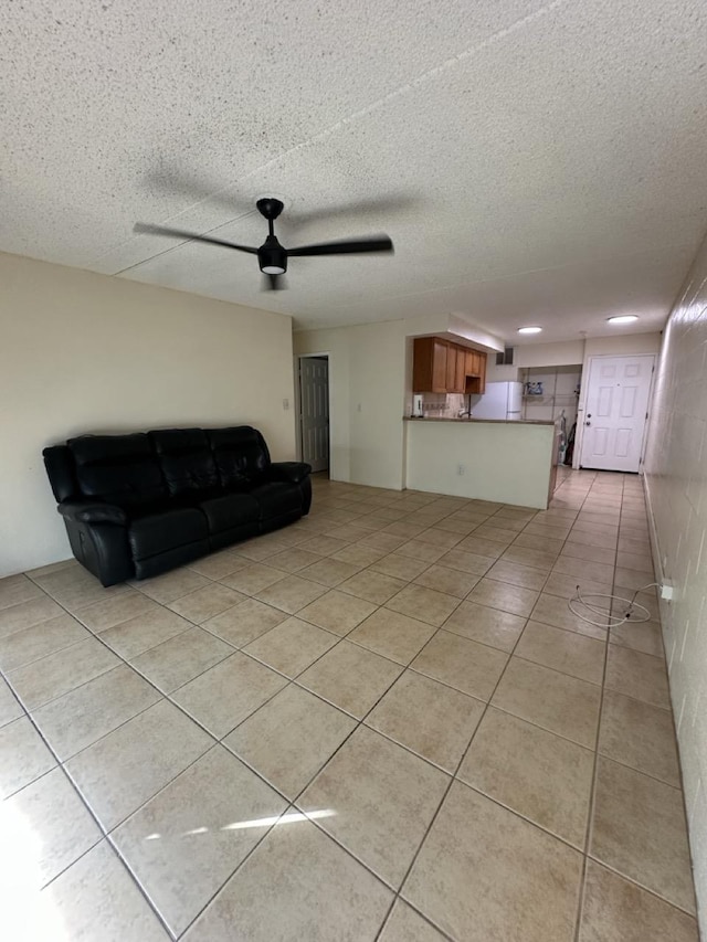 111 Kahului Beach Rd Unit A407, Kahului, HI 96732 - living room featuring light tile patterned floors and a ceiling fan