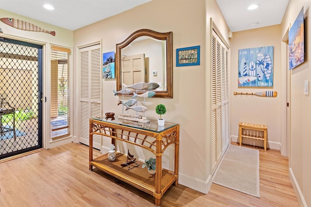 entryway with light hardwood / wood-style flooring