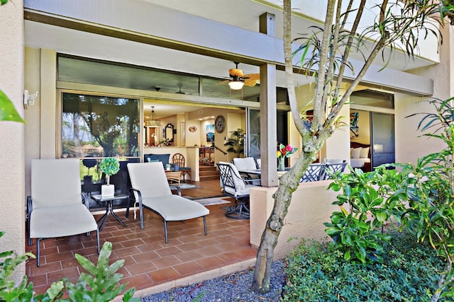 view of patio featuring ceiling fan