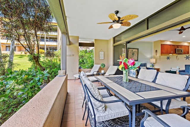 view of patio / terrace featuring ceiling fan