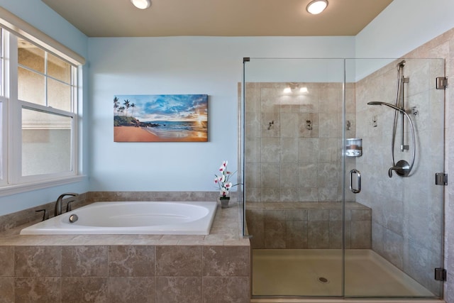 full bathroom with a stall shower and a garden tub