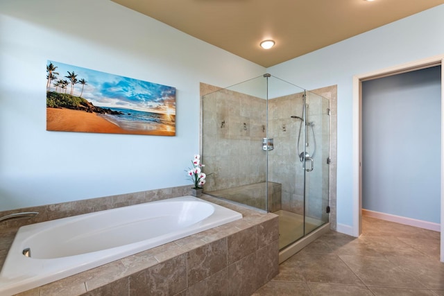 full bath with a garden tub, baseboards, a stall shower, and tile patterned flooring