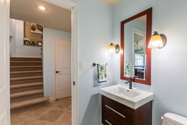 bathroom with toilet, tile patterned floors, recessed lighting, and vanity