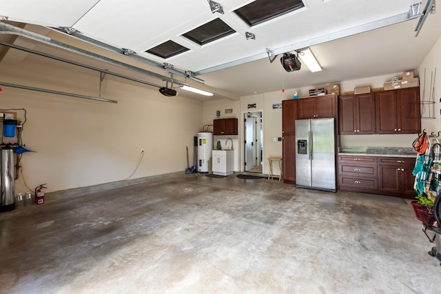 garage with water heater, a garage door opener, and stainless steel refrigerator with ice dispenser