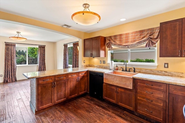 kitchen with kitchen peninsula, dishwasher, sink, and dark hardwood / wood-style floors