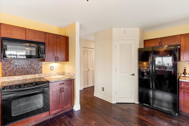 kitchen featuring black appliances, decorative backsplash, light stone counters, and dark hardwood / wood-style flooring