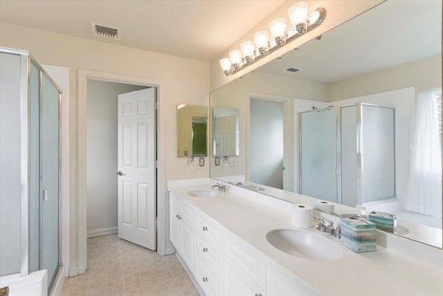 bathroom with vanity and walk in shower